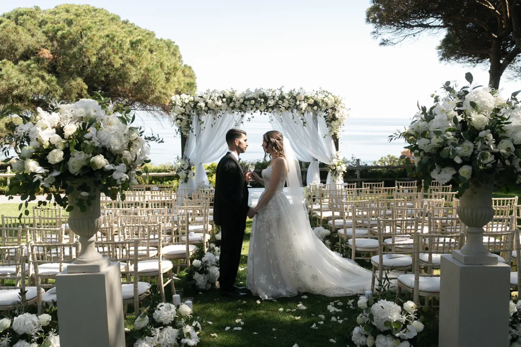 wedding ceremony at pine cliffs algarve with stunning florals