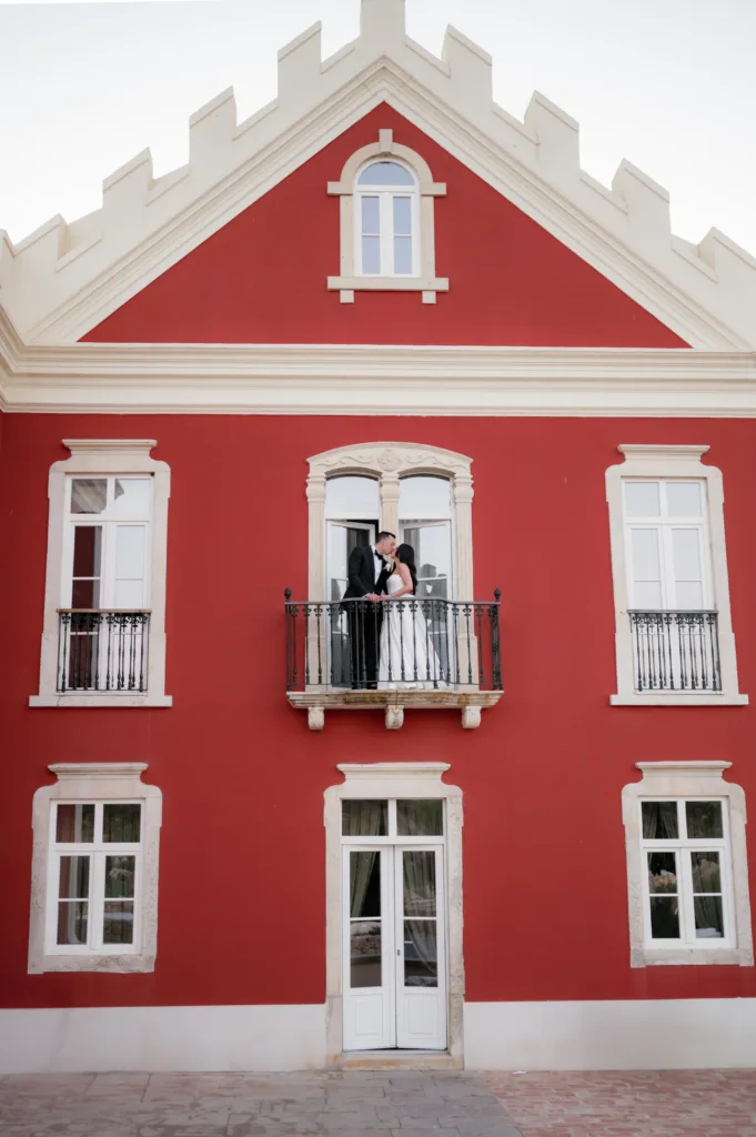 bride and groom at the balcony of the Palace at algarve wedding venue