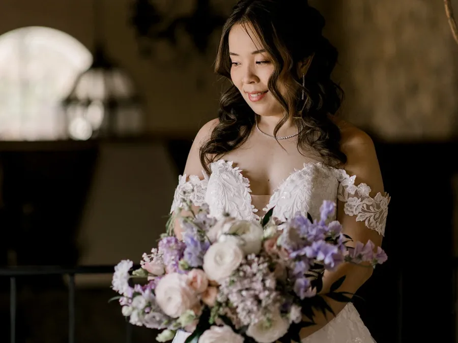 bride with bridal bouquet pastel lilac flowers
