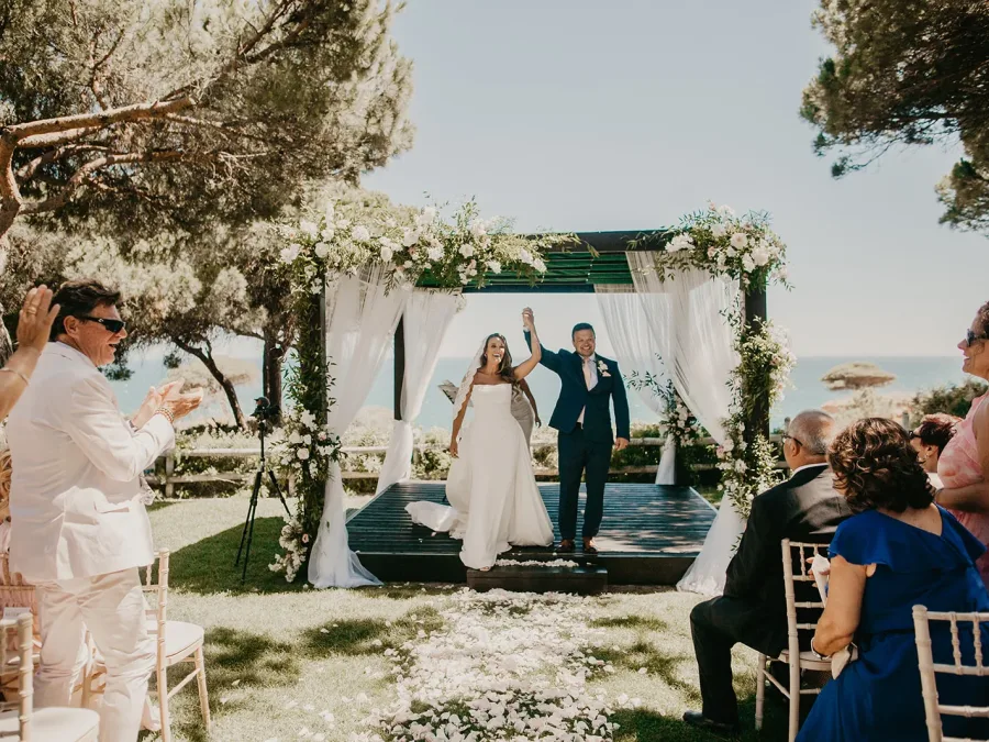 Victoria and Filipe’s wedding ceremony in the lush clifftop pine garden at Pine Cliffs Resort, Algarve, Portugal