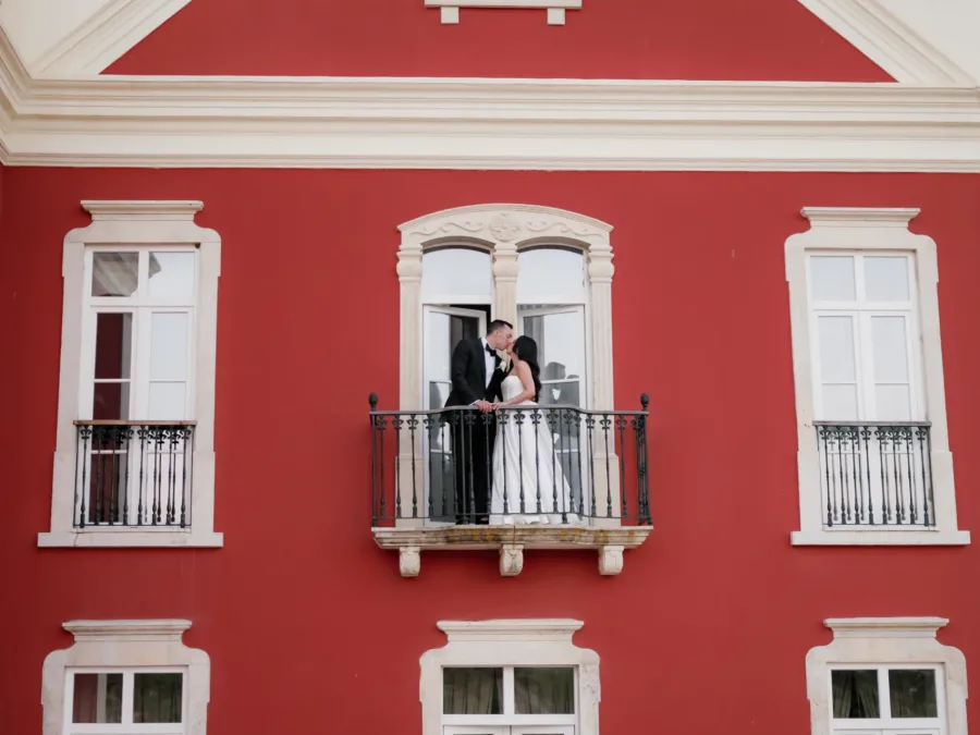 bride and groom at the balcony of the Palace at algarve wedding venue