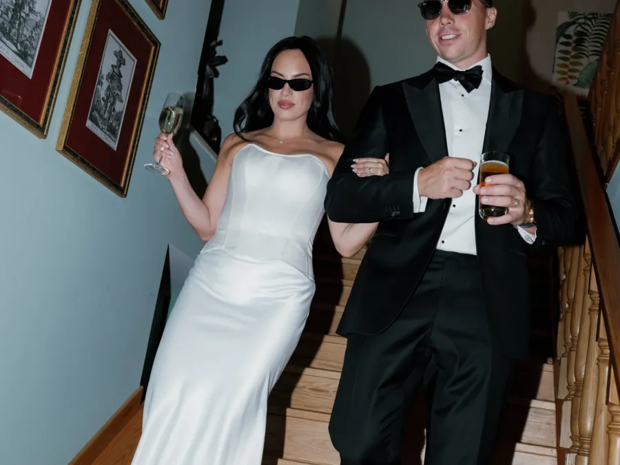 bride and groom on the staircase of solar do paço algarve